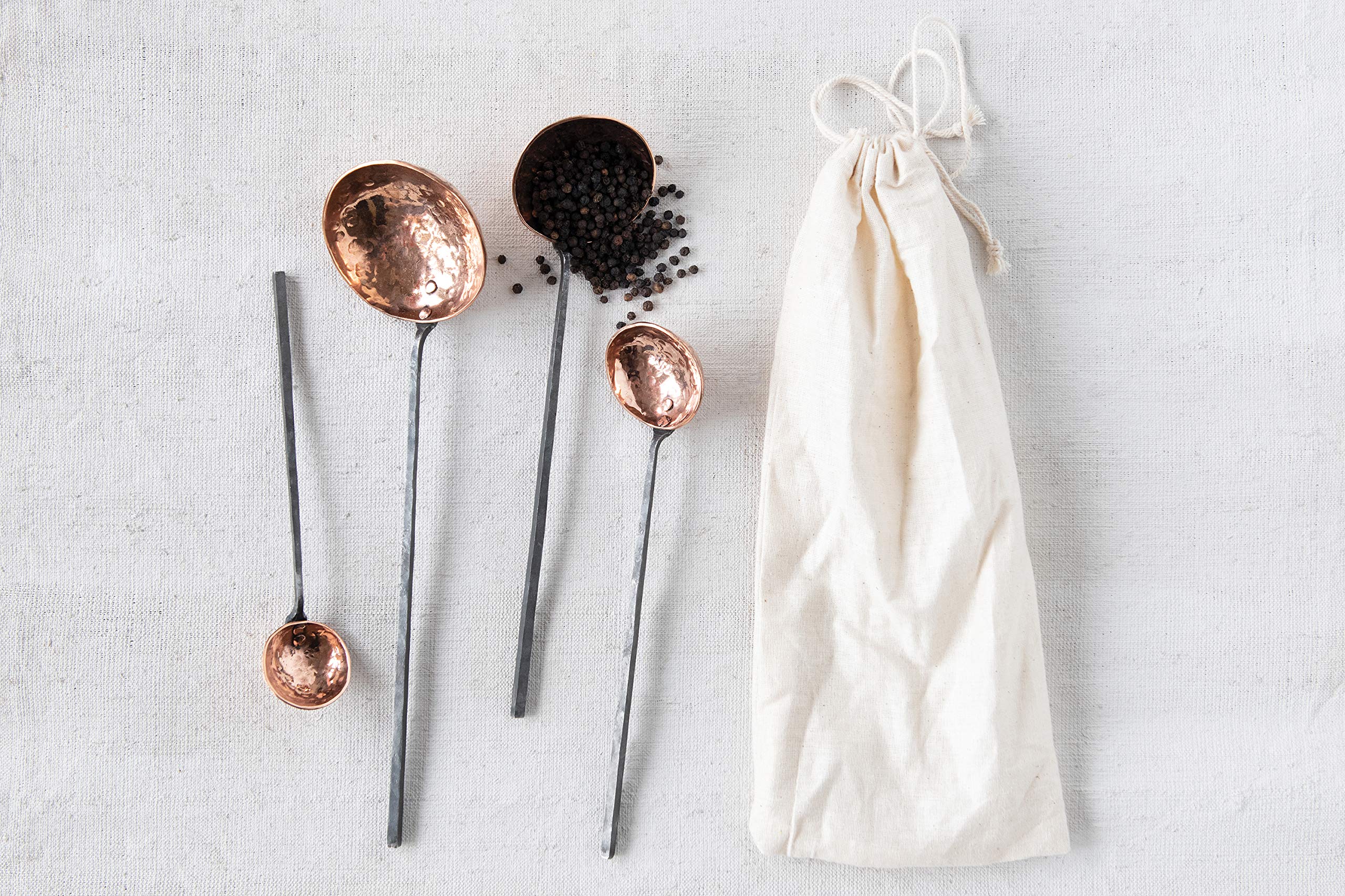 Creative Co-Op close-up of hammered copper texture on ladle bowl, highlights artisanal detail