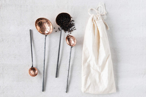 Creative Co-Op close-up of hammered copper texture on ladle bowl, highlights artisanal detail