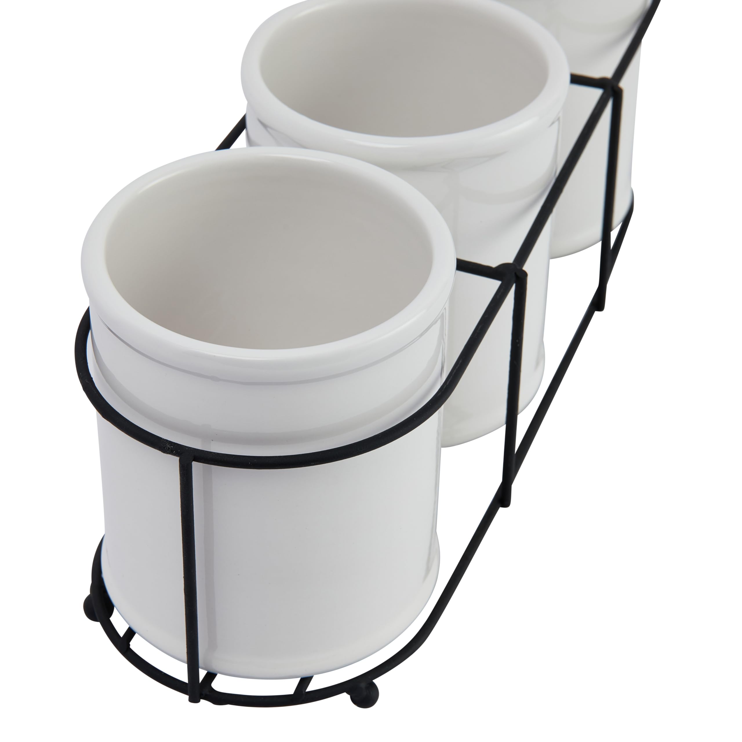 Creative Co-Op crocks on bathroom vanity holding brushes for space-saving benefit