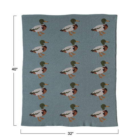 Creative Co-Op blanket styled in crib adding color and playful charm to nursery