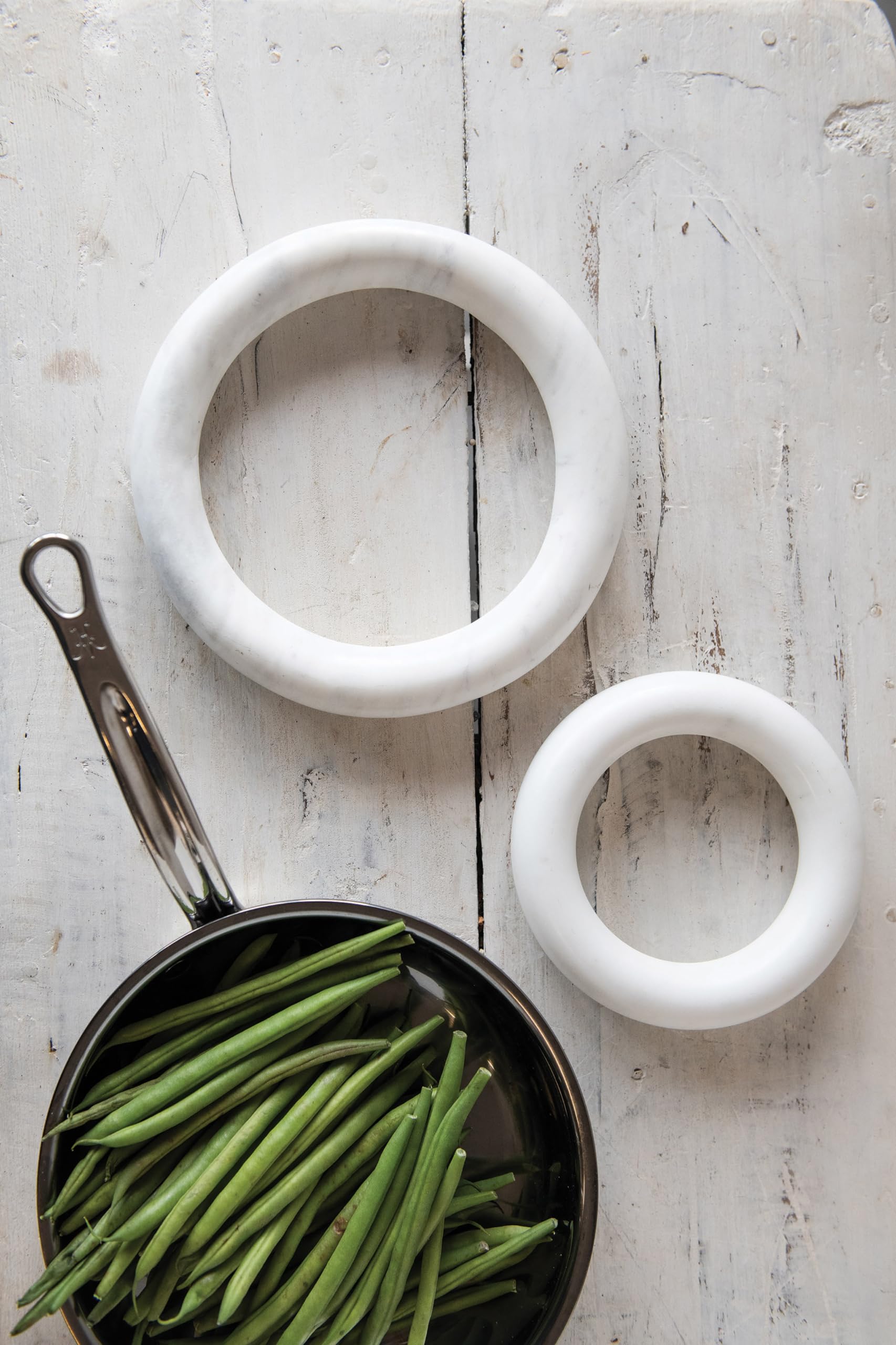 Creative Co-Op marble trivets stacked neatly showing compact storage and organization benefit