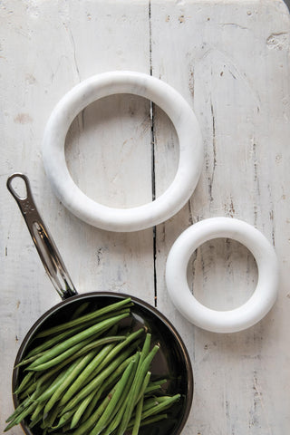 Creative Co-Op marble trivets stacked neatly showing compact storage and organization benefit