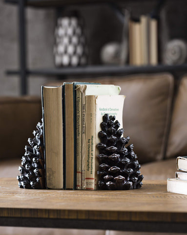 Creative Co-Op pinecone bookends packaging and pair showing what’s included in set