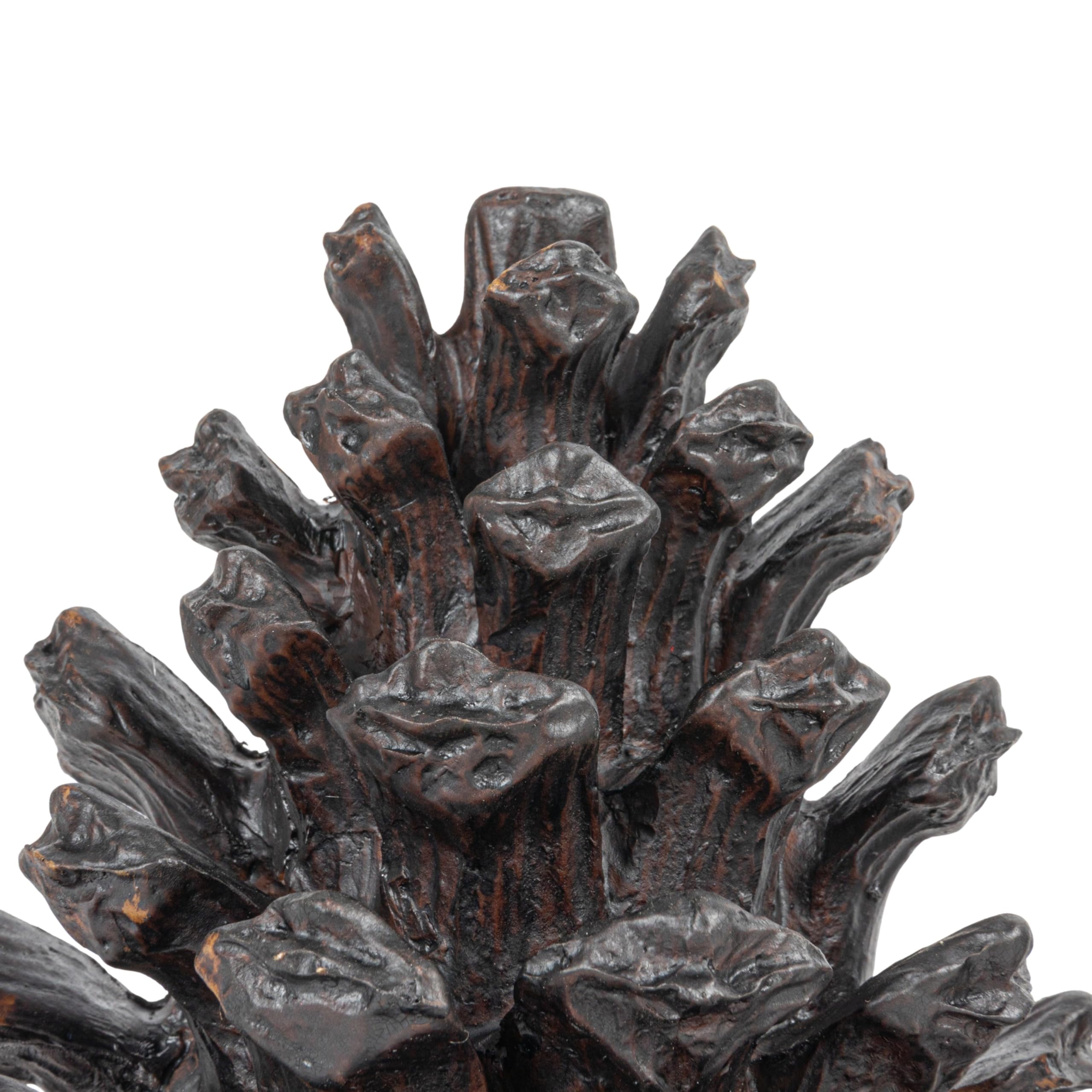 Creative Co-Op pinecone bookend next to books to show size and practical scale