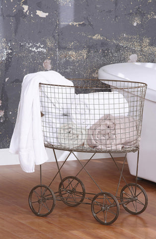 Creative Co-Op oversized antique-style wheels detail for easy indoor mobility and style