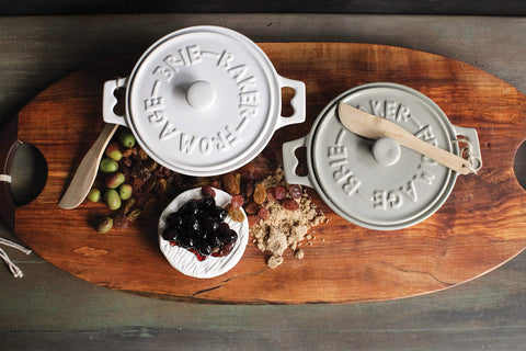Creative Co-Op baker held in hand illustrating compact 7-inch size for portion control