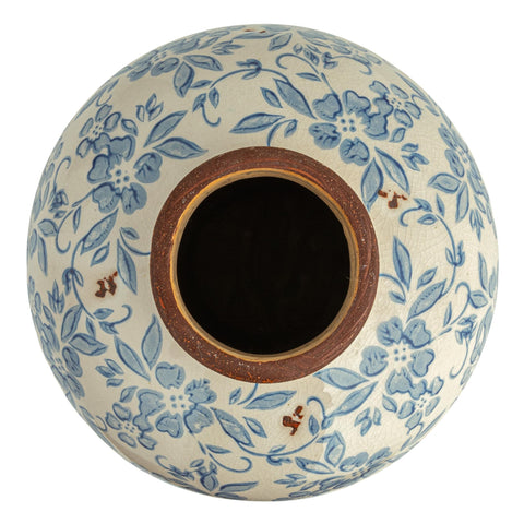Creative Co-Op vase styled with small bouquet to add color to room
