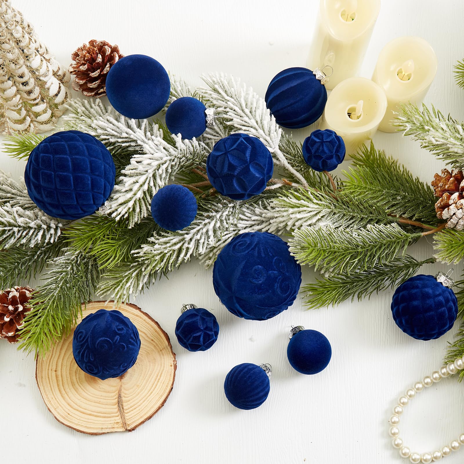 CristBest ornaments hanging on a lit tree adding rich navy contrast