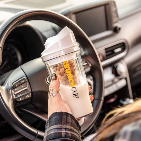 CRUNCHCUP in car cupholder showing convenient commute use