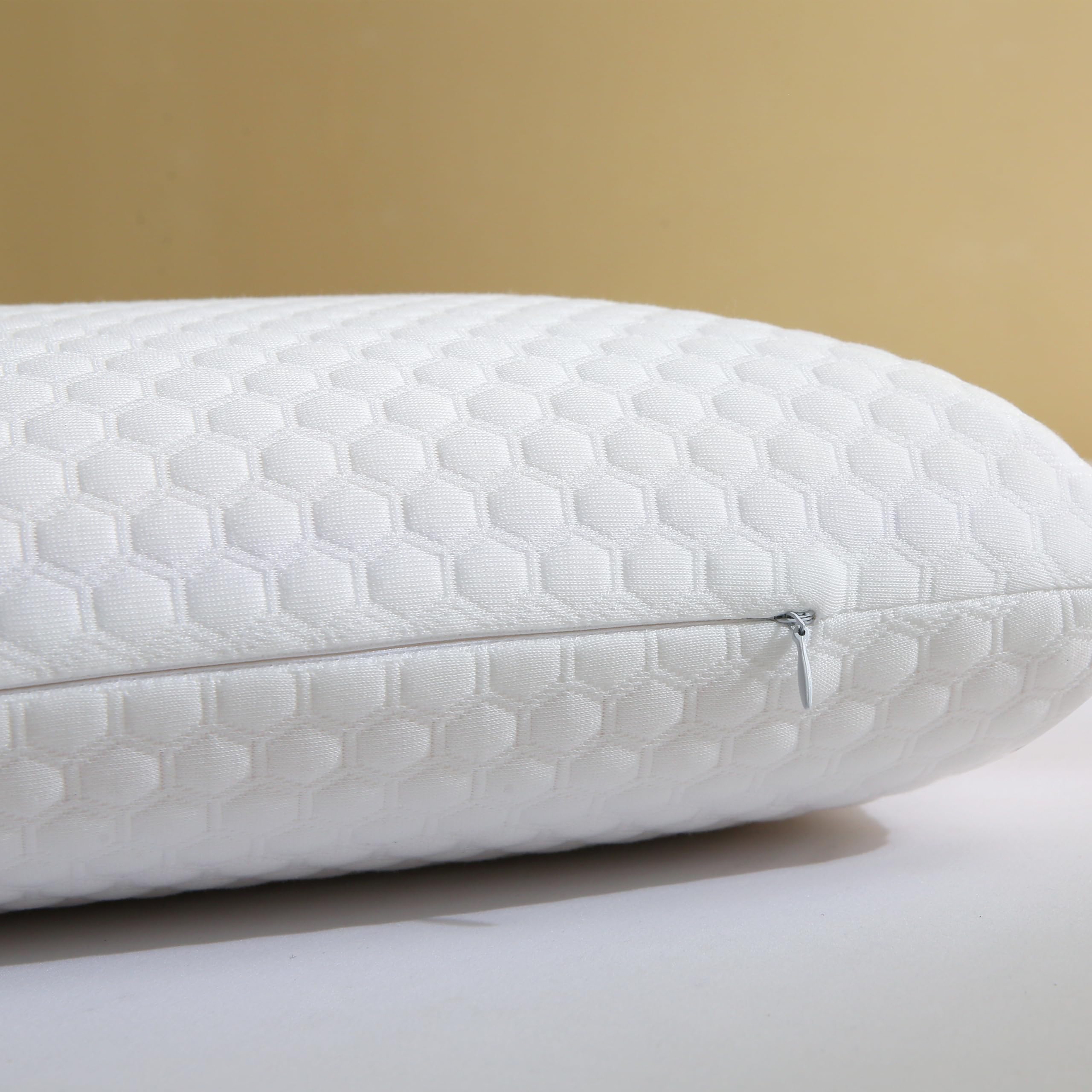 CSDLF pillow on bed with back sleeper demonstrating supportive alignment