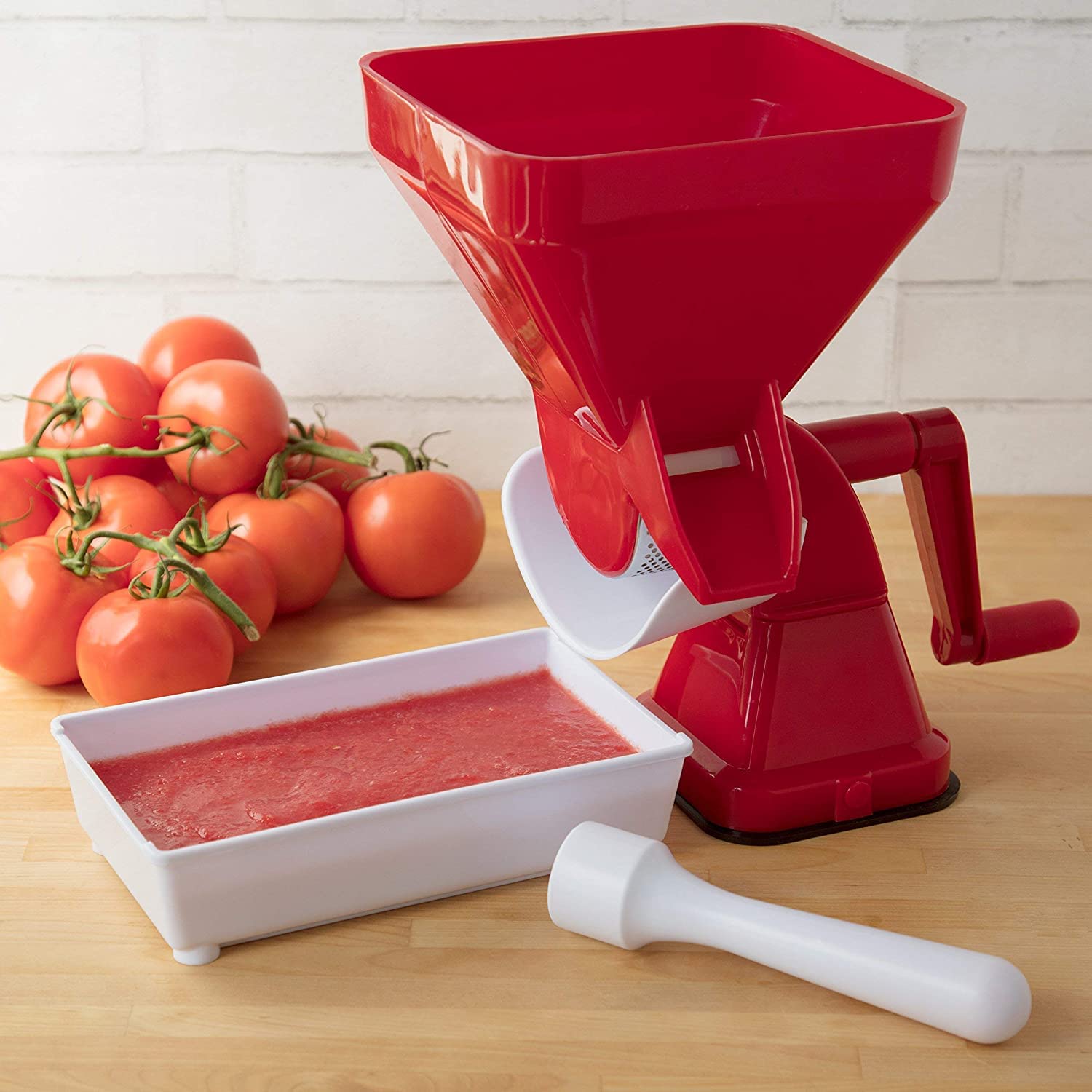CucinaPro in a kitchen with fresh tomatoes highlighting seasonal sauce prep