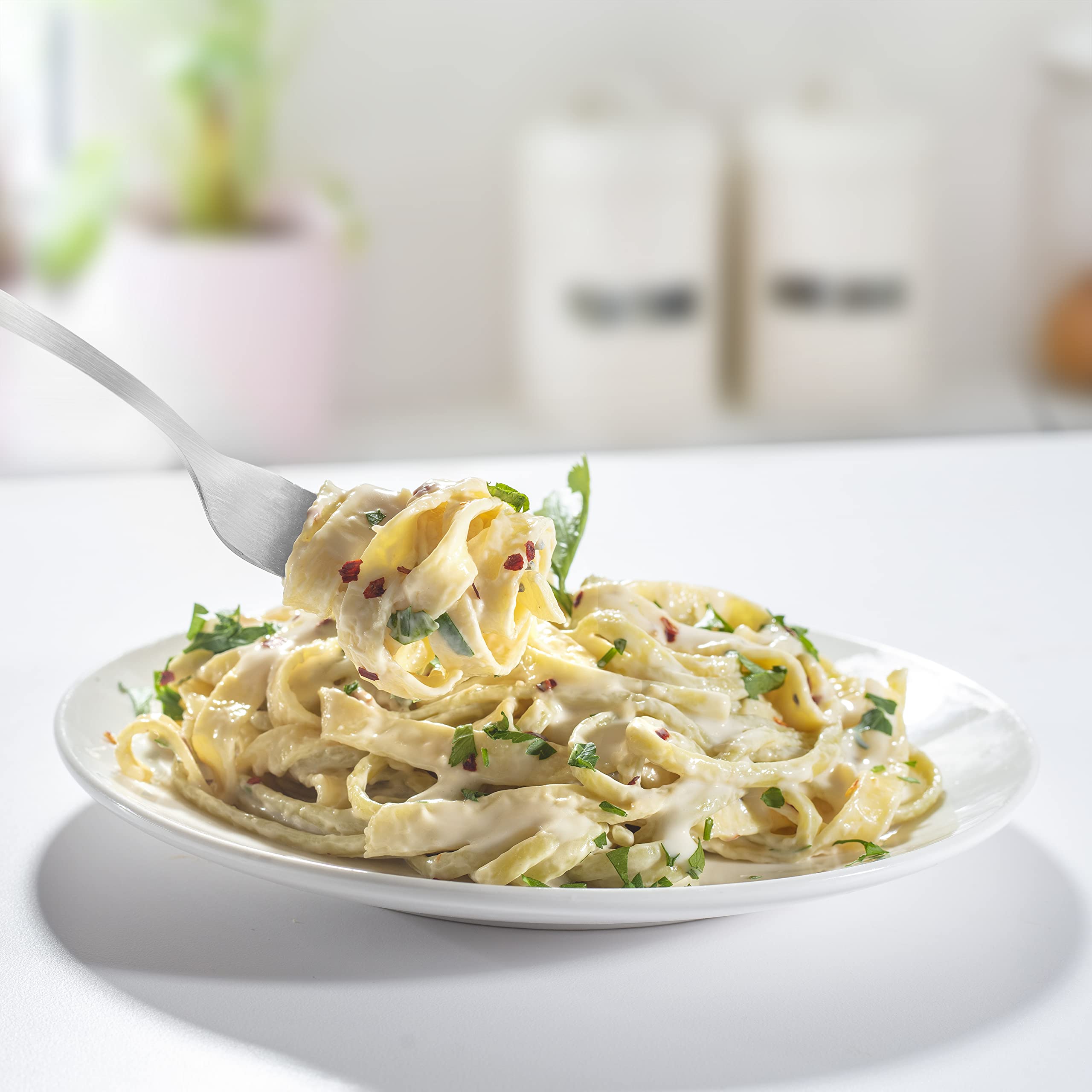 CucinaPro pasta maker in a kitchen lifestyle scene showing real-world use benefit