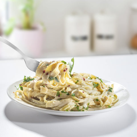 CucinaPro pasta maker in a kitchen lifestyle scene showing real-world use benefit