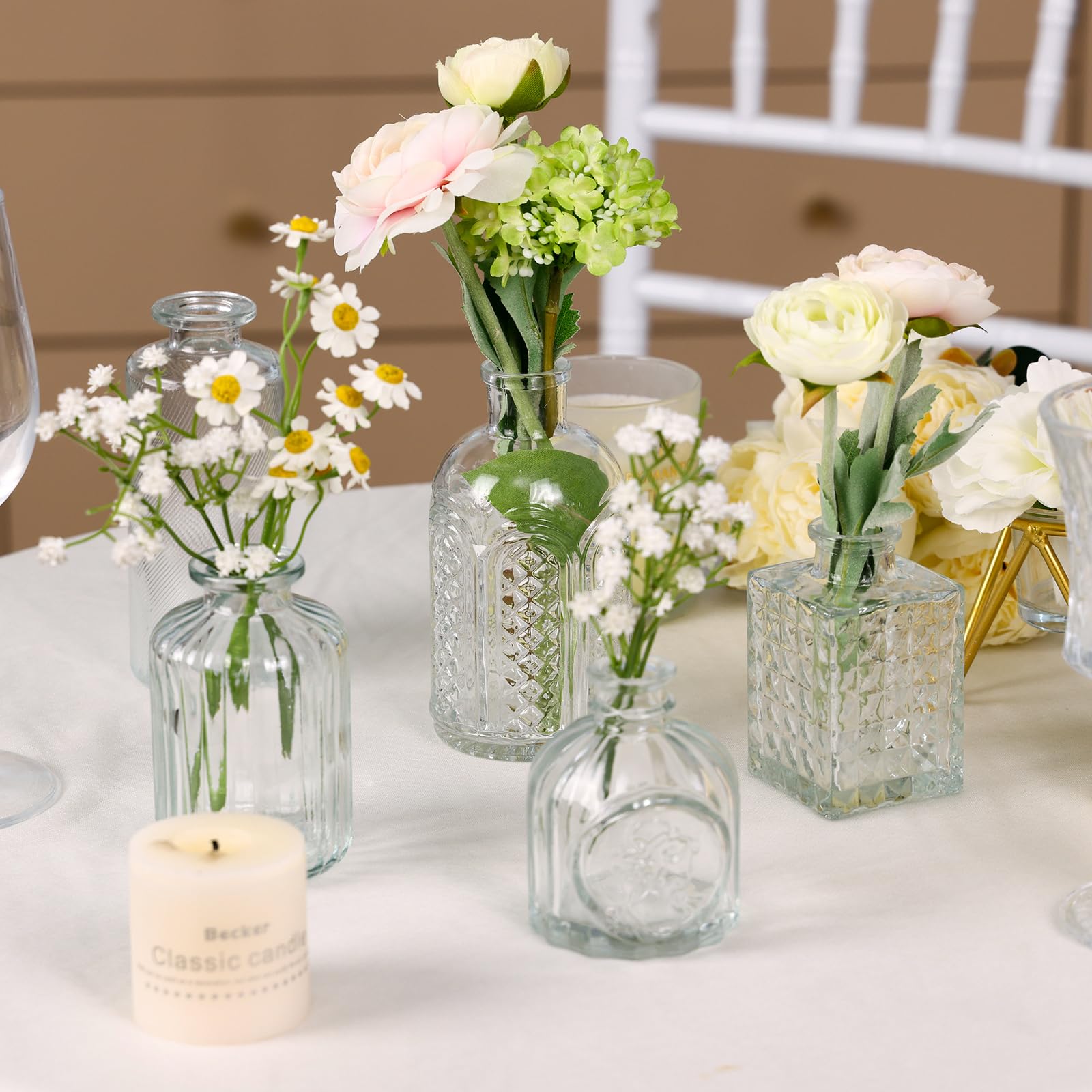 CUCUMI vases on a windowsill catching light, adding brightness and charm