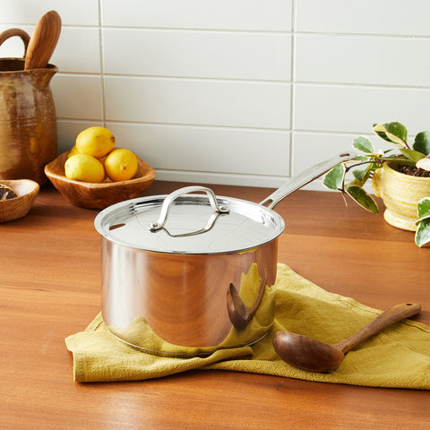 Cuisinart saucepan base close-up shows aluminum-encapsulated core for even heating