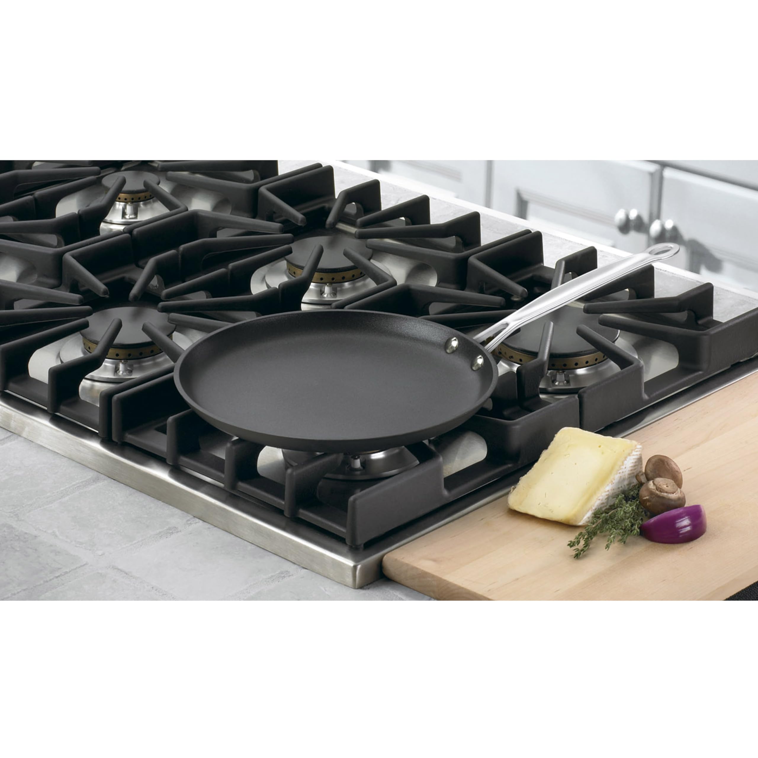 Cuisinart crepe pan in use flipping a crepe, demonstrating easy release and quick heating