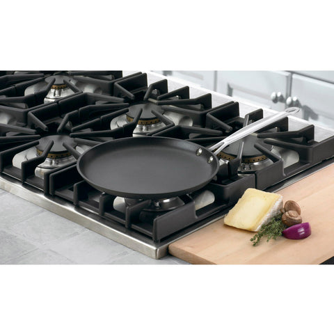 Cuisinart crepe pan in use flipping a crepe, demonstrating easy release and quick heating