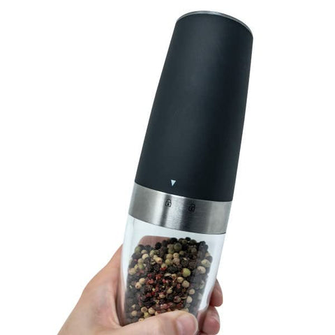 Cuisinart grinders on a grill table illustrating outdoor portable seasoning