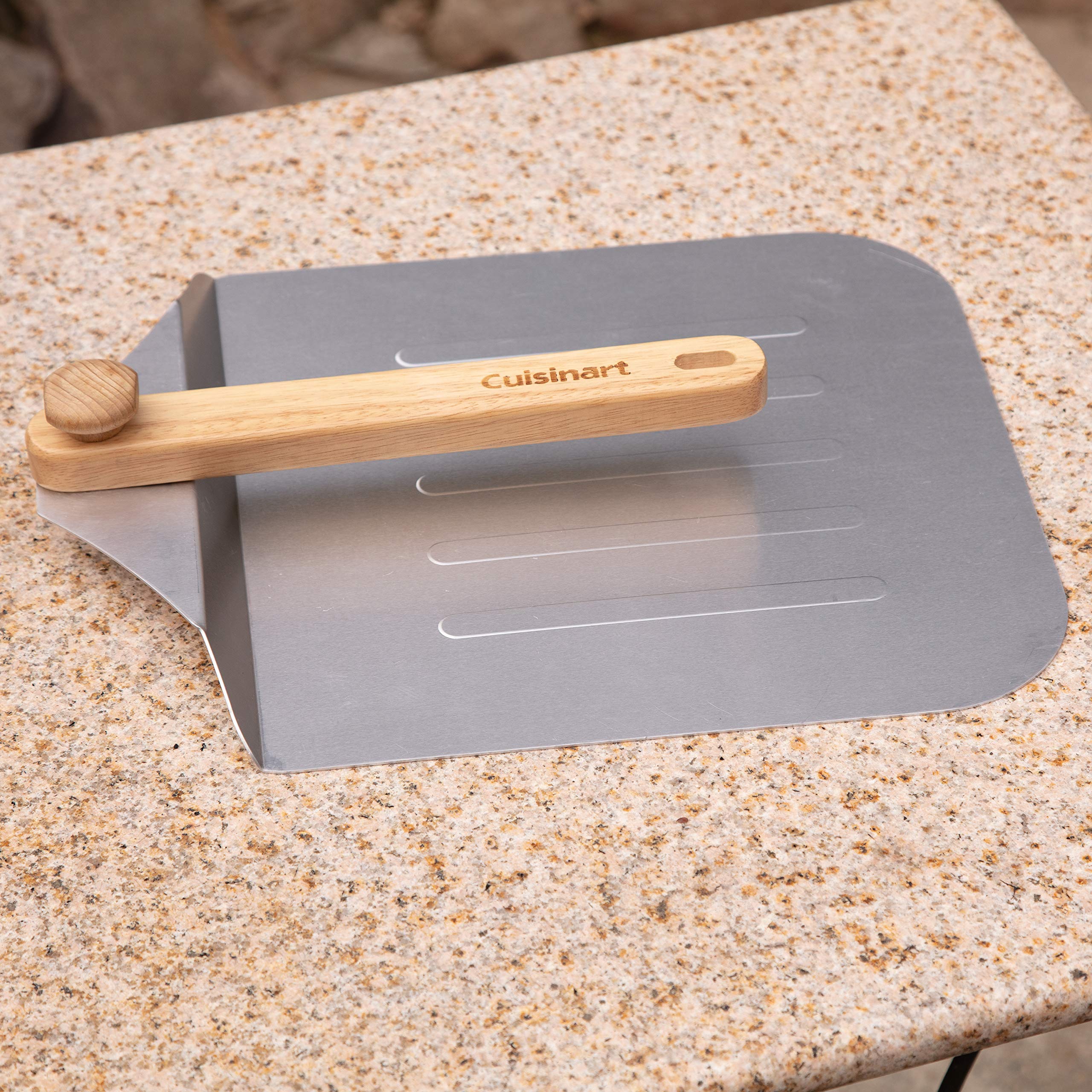 Cuisinart in use placing pizza into oven for faster transfers