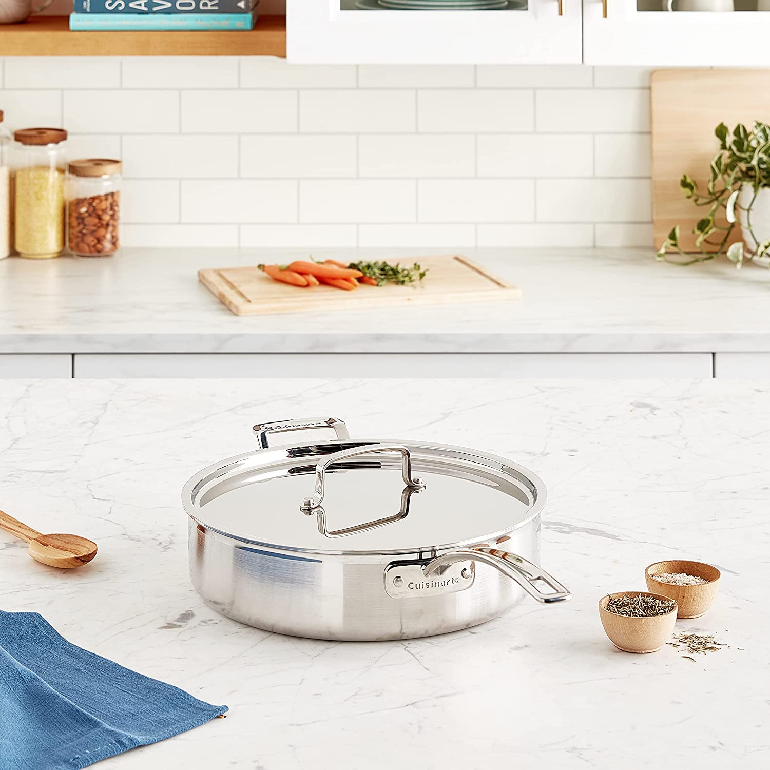 Cuisinart MultiClad Pro skillet on stovetop with sautéed vegetables demonstrating even heating