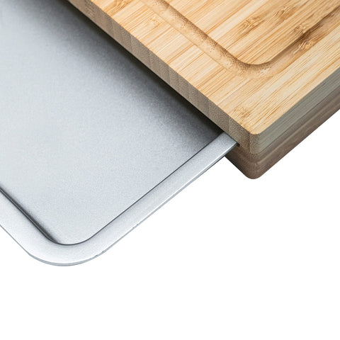 Cuisinart cutting board shown with utensils for size and scale reference