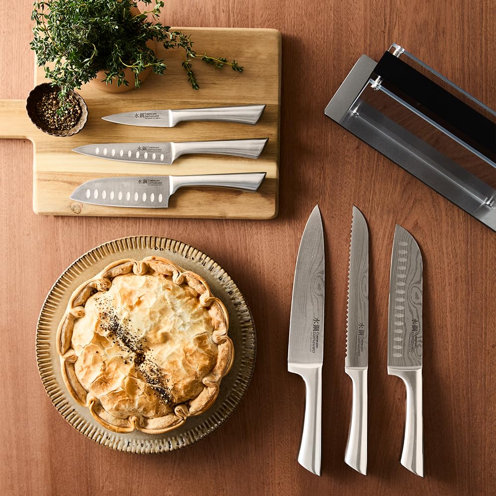 CUISINE::PRO bread knife slicing loaf cleanly to show serrated cutting efficiency
