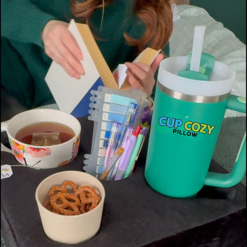 Cup Cozy Pillow at the beach resisting sand and simplifying outdoor snacking