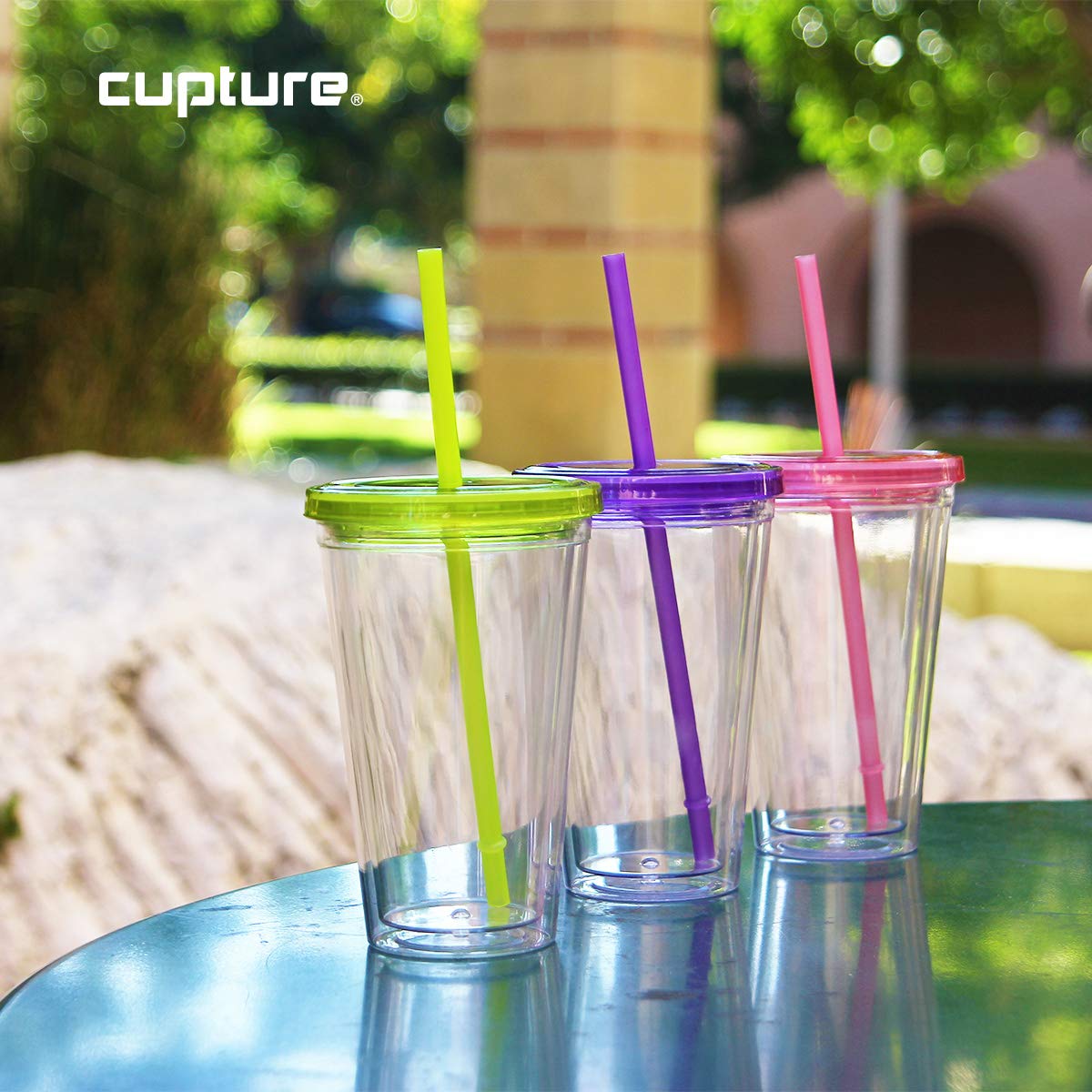 Cupture reusable straw inserted into lid for easy sipping and portability