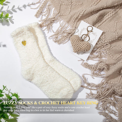 CuriBox silk eye mask and plush socks staged to promote restful comfort