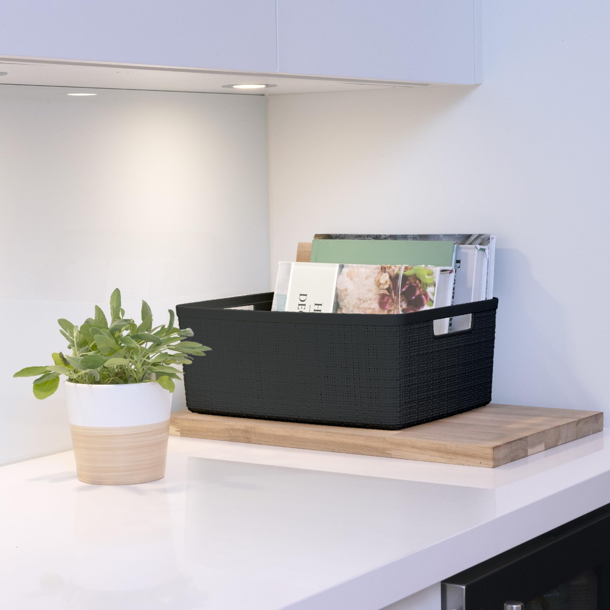 Curver basket in pantry with jars showing versatile kitchen storage benefit