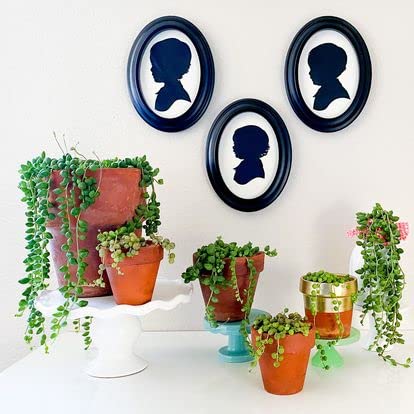CUT ARTS back view revealing hanging hardware and easel stand for versatility