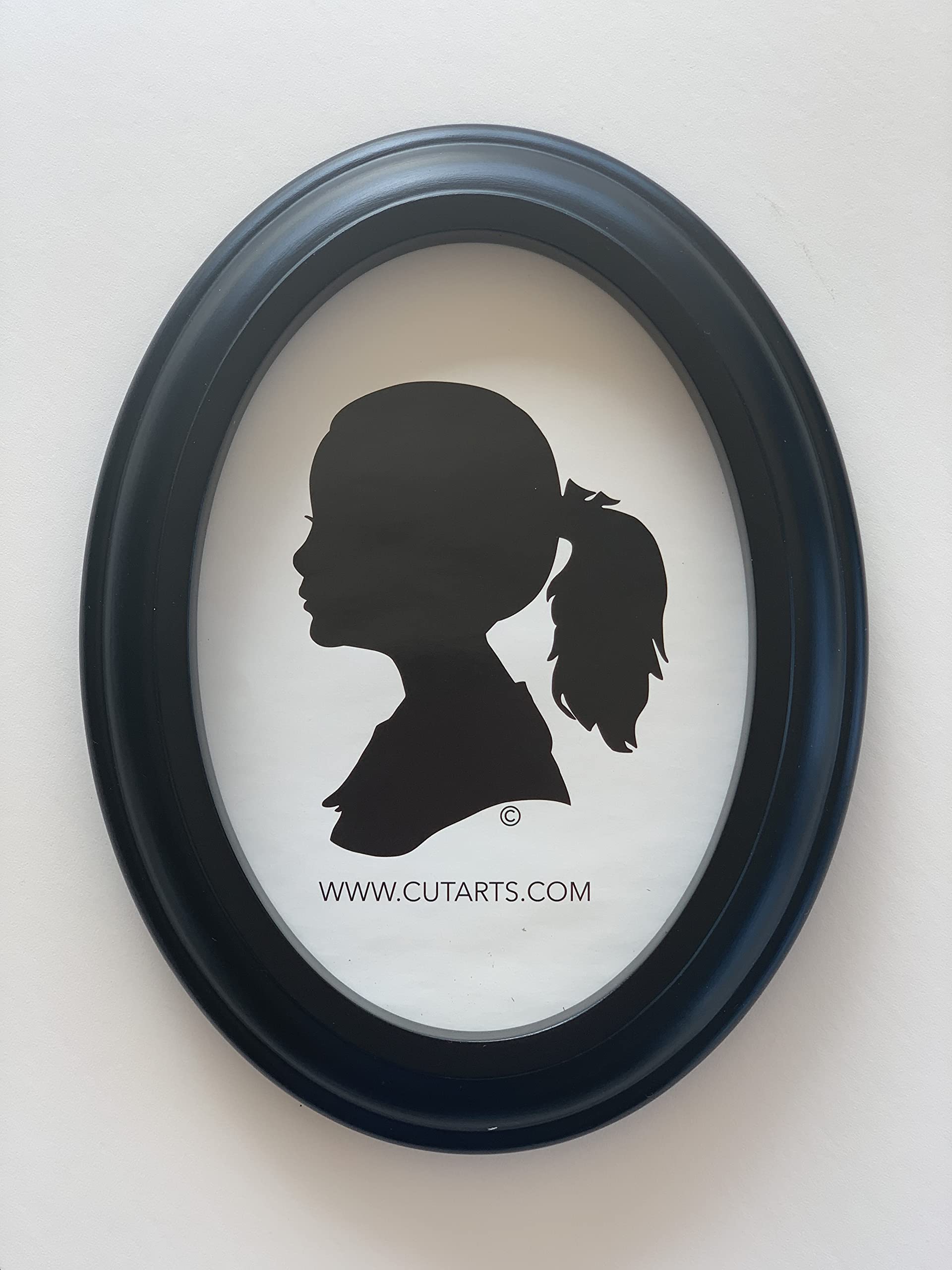CUT ARTS frame with photo insert demonstrating centered oval composition