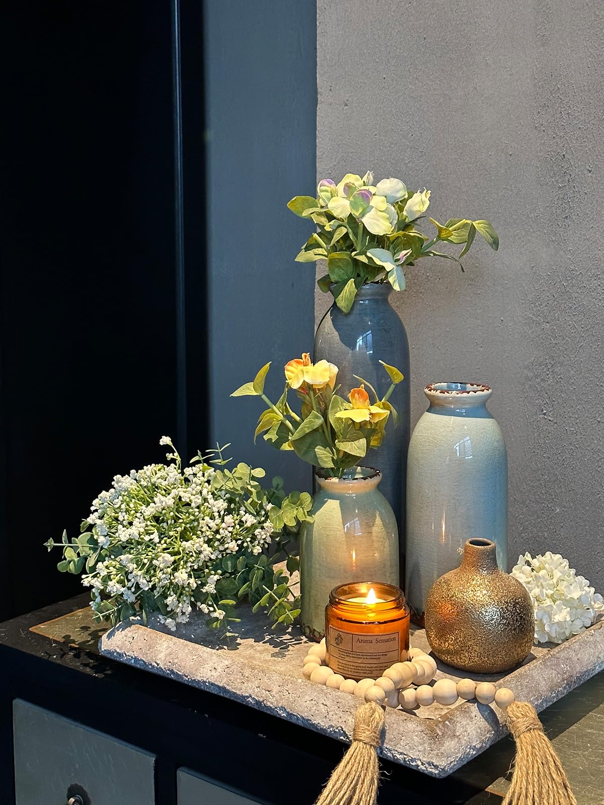 CwlwGO trio styled on a living room shelf offering layered height and visual interest