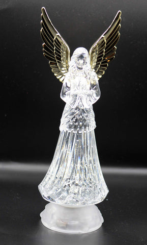 Dalax angel lamp on bedside table in bedroom creating soft nightlight mood and comfort