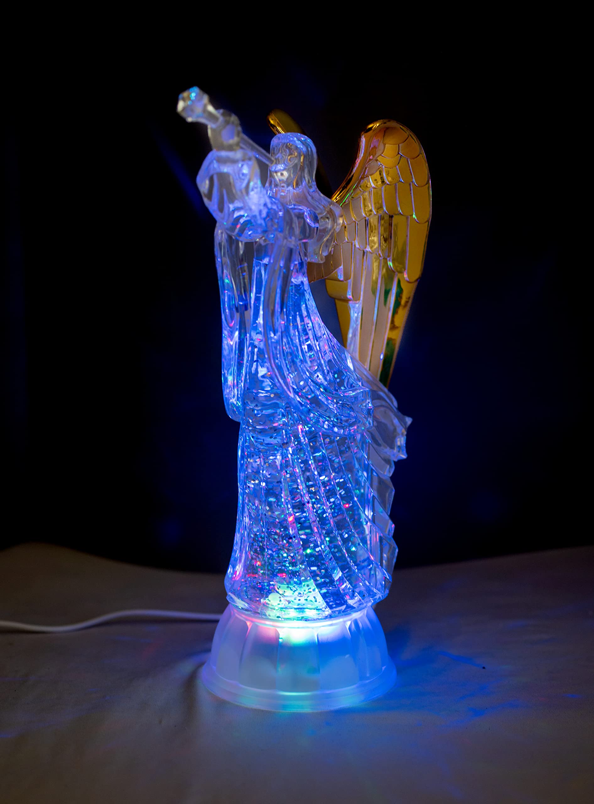Dalax statue beside ruler showing 12-inch scale for size clarity