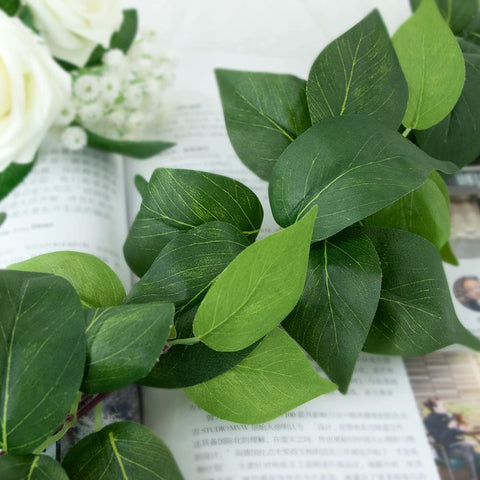 dallisten hanging over archway creating lush ceremony look and instant green backdrop