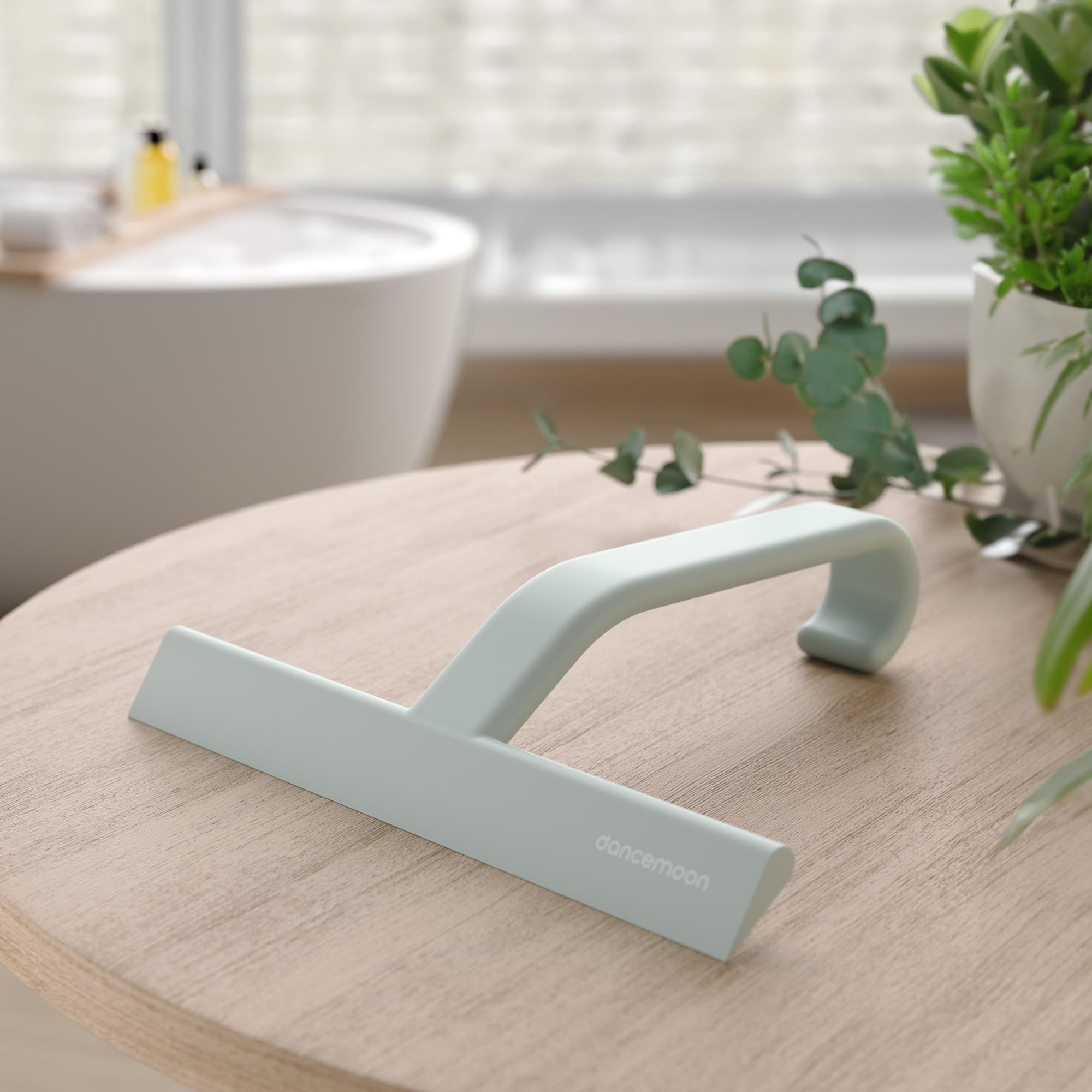 dancemoon squeegee held in hand showing ergonomic grip and balanced weight