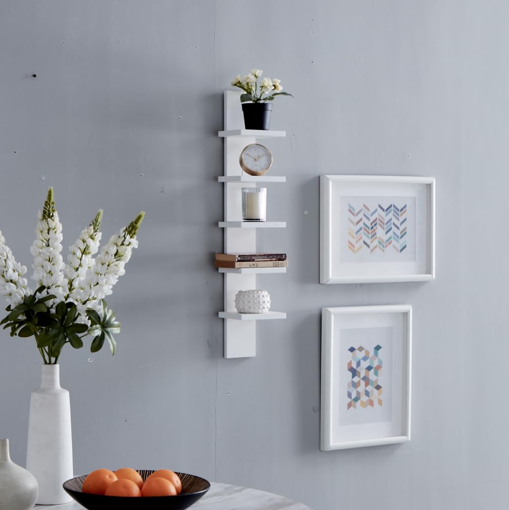 Danya B shelf with books and decor demonstrating compact layered storage