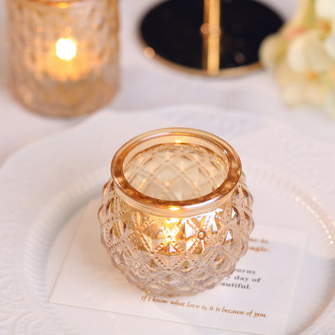 DARJEN gold votives lit on a table creating warm atmosphere for event benefit