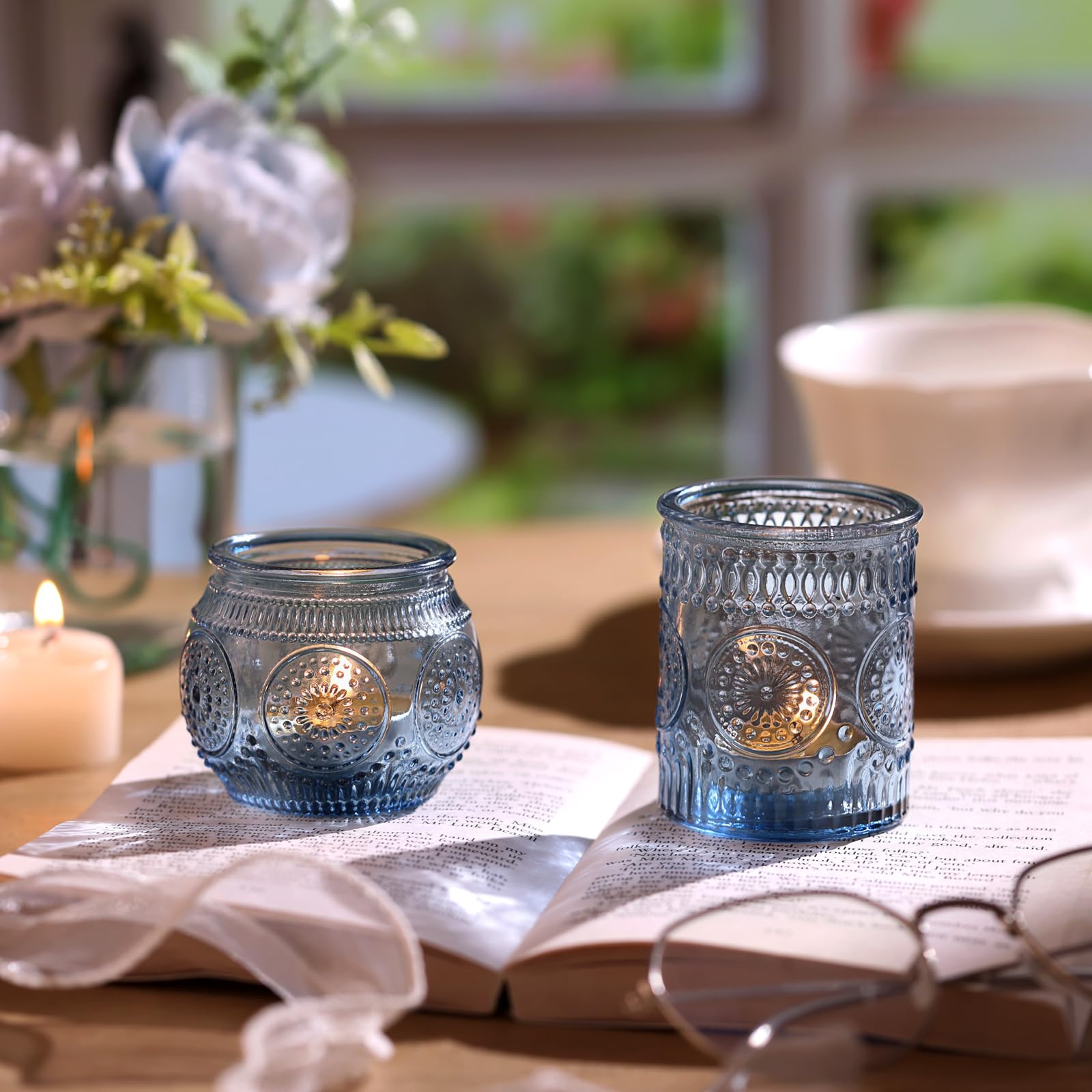 DARJEN lit tea light in holder creating warm centerpiece ambiance
