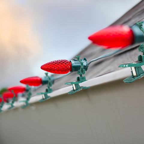 Dazzle Bright clip attached to a gutter demonstrating quick tool-free benefit
