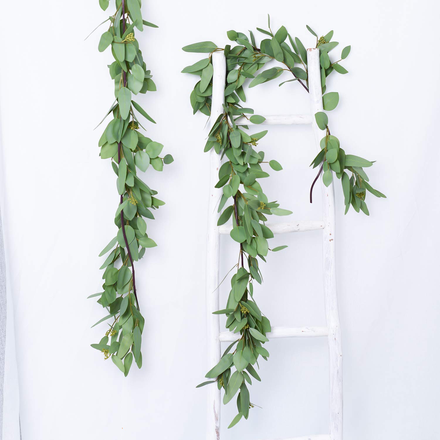 DearHouse garland styled on a mantel adding rustic greenery to home interiors