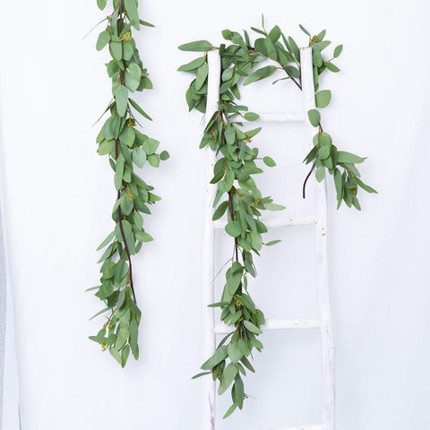 DearHouse garland styled on a mantel adding rustic greenery to home interiors