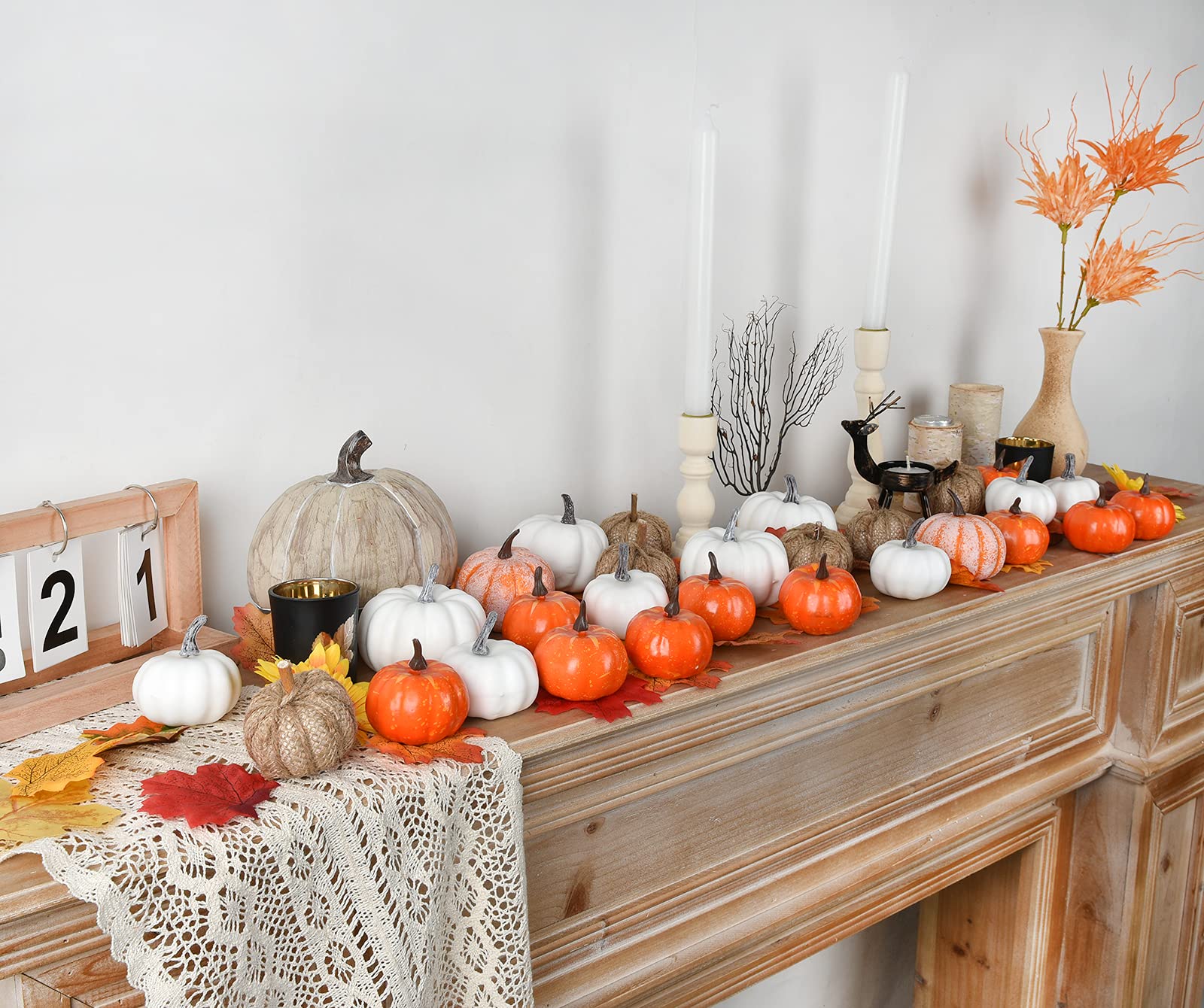 Top view of DearHouse assorted mini pumpkins in orange, burlap, and white showing variety and texture