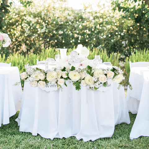 DearHouse garland framing doorway arch establishes instant ceremony backdrop