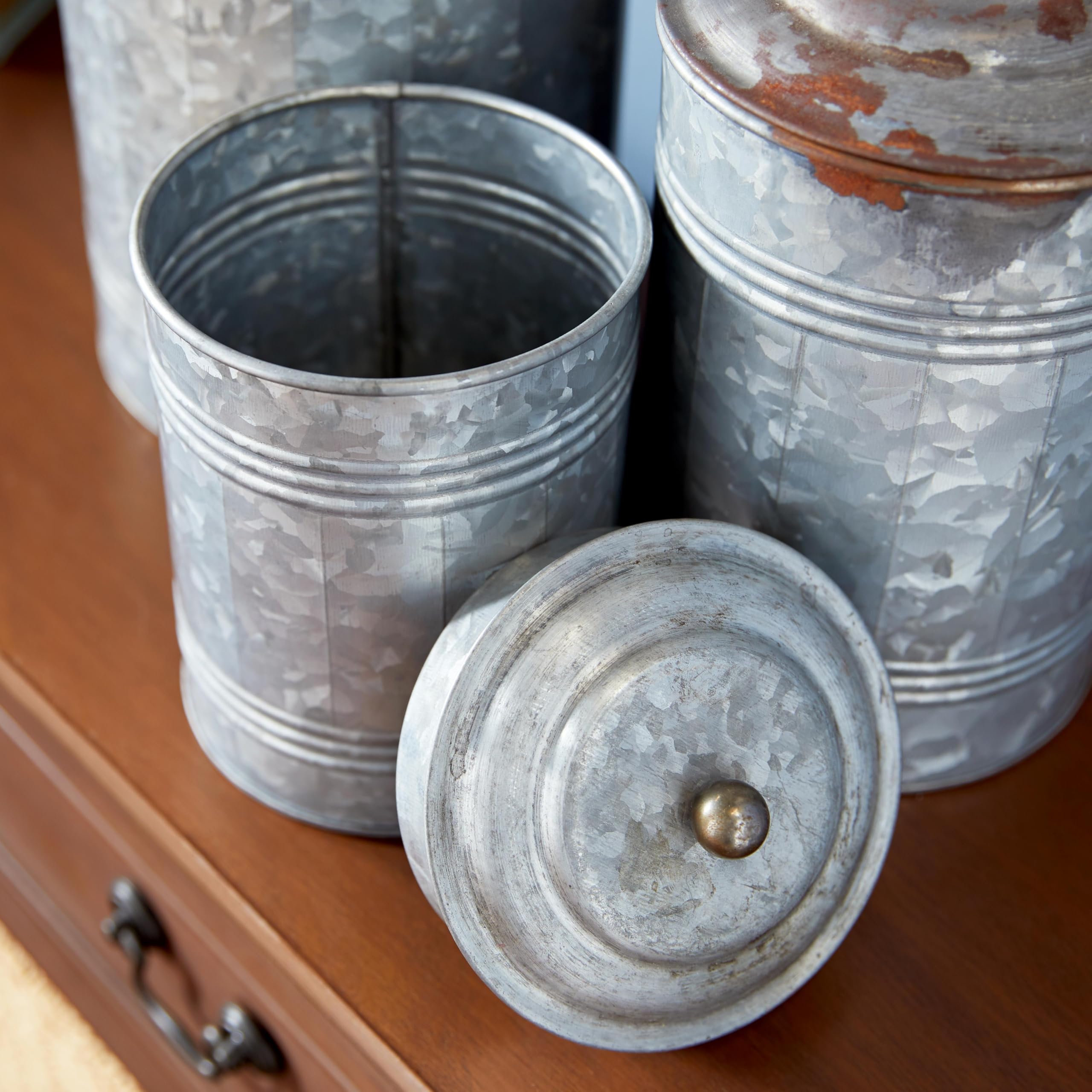 deco 79 jars displayed on shelf stacked for layered farmhouse decor benefit