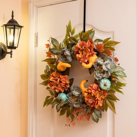 Decor by Hannah wreath on mantel styled as autumn centerpiece and cozy look