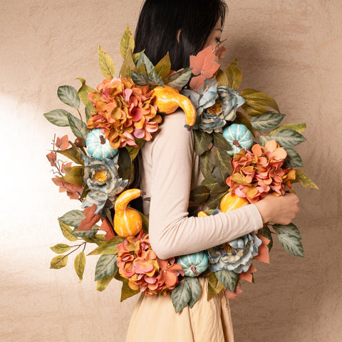Decor by Hannah wreath next to door showing 24-inch scale and fit