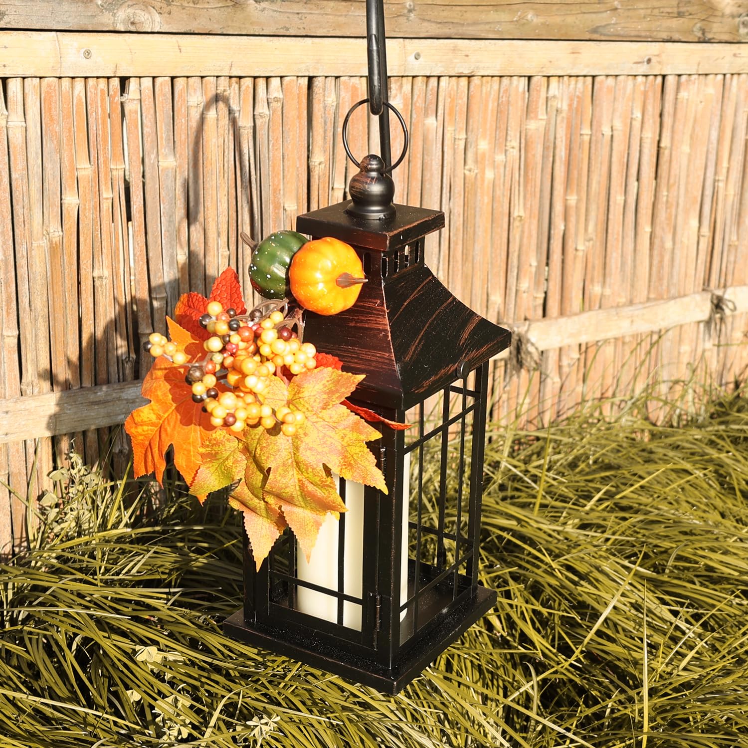 DECORKEY lantern next to hand for size comparison showing compact height