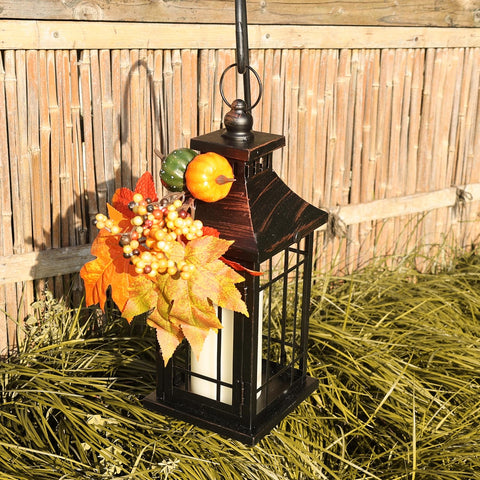 DECORKEY lantern next to hand for size comparison showing compact height
